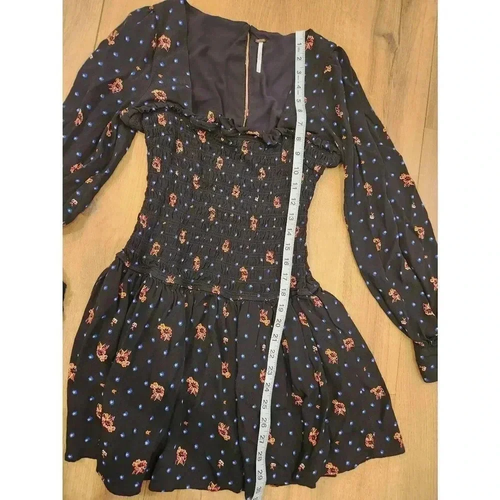 Free People Two Faces Smocked Bodice Floral Mini Dress Long Sleeved Size XS.